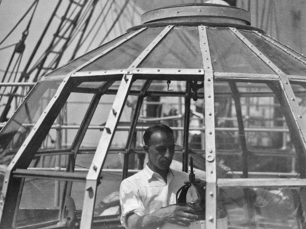 man standing in a glass geodesic dome