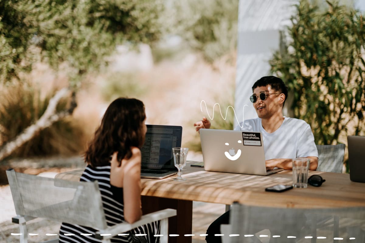 People sitting outside and working on computers