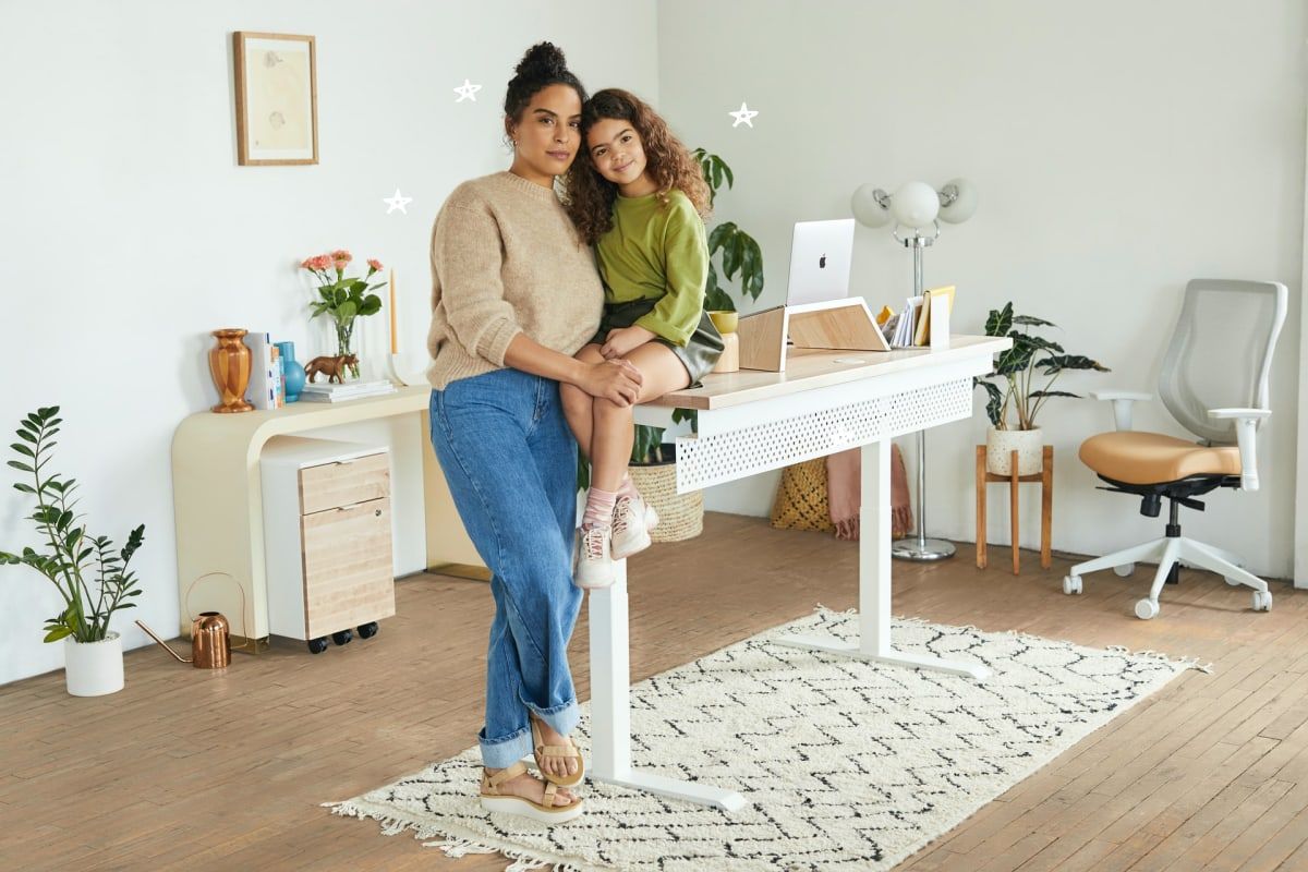 Woman and daughter in home office