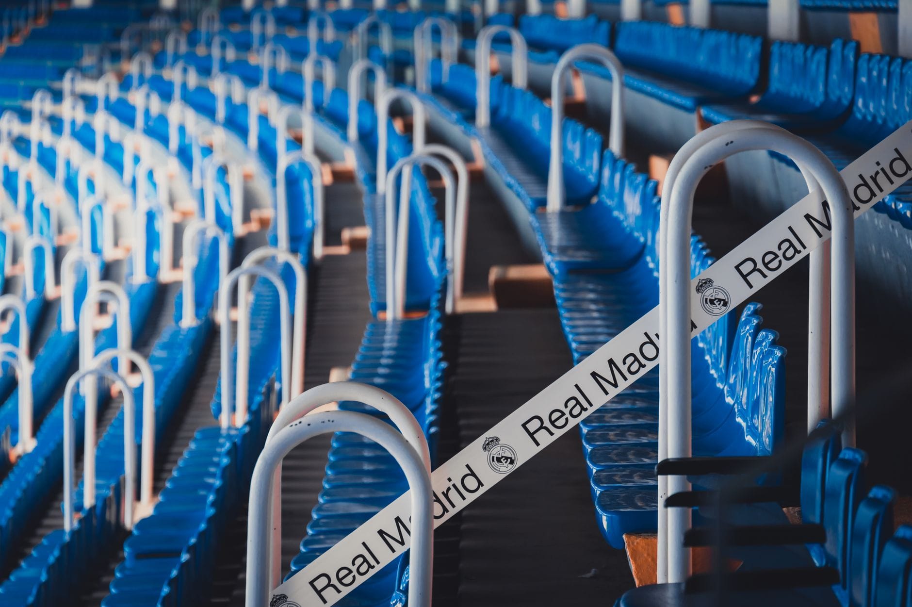 Premier League football stadium with visible shirt sponsorship on pitch