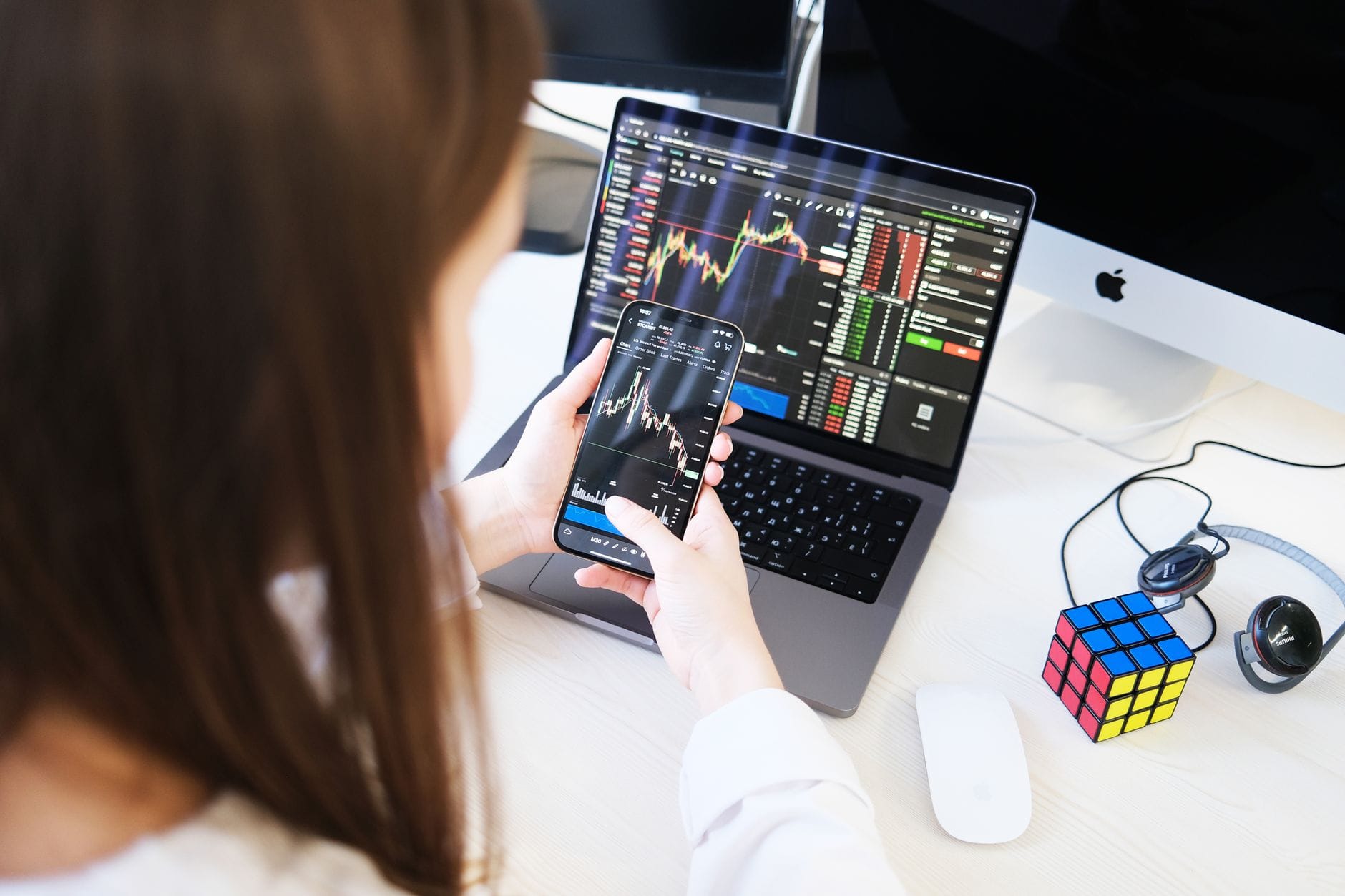 Trader reviewing cryptocurrency exchange platforms on laptop screen