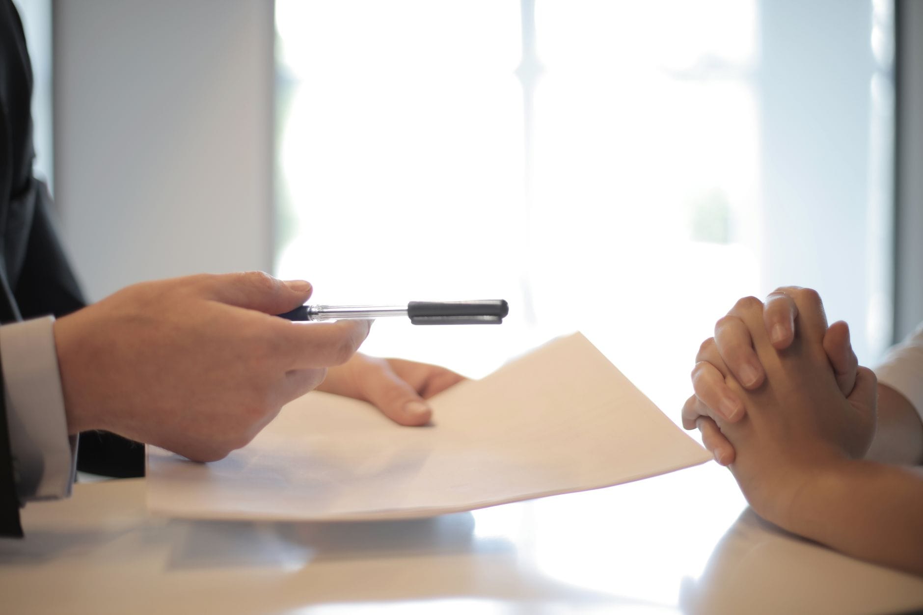 Business professionals reviewing financial documents during strategic negotiation session