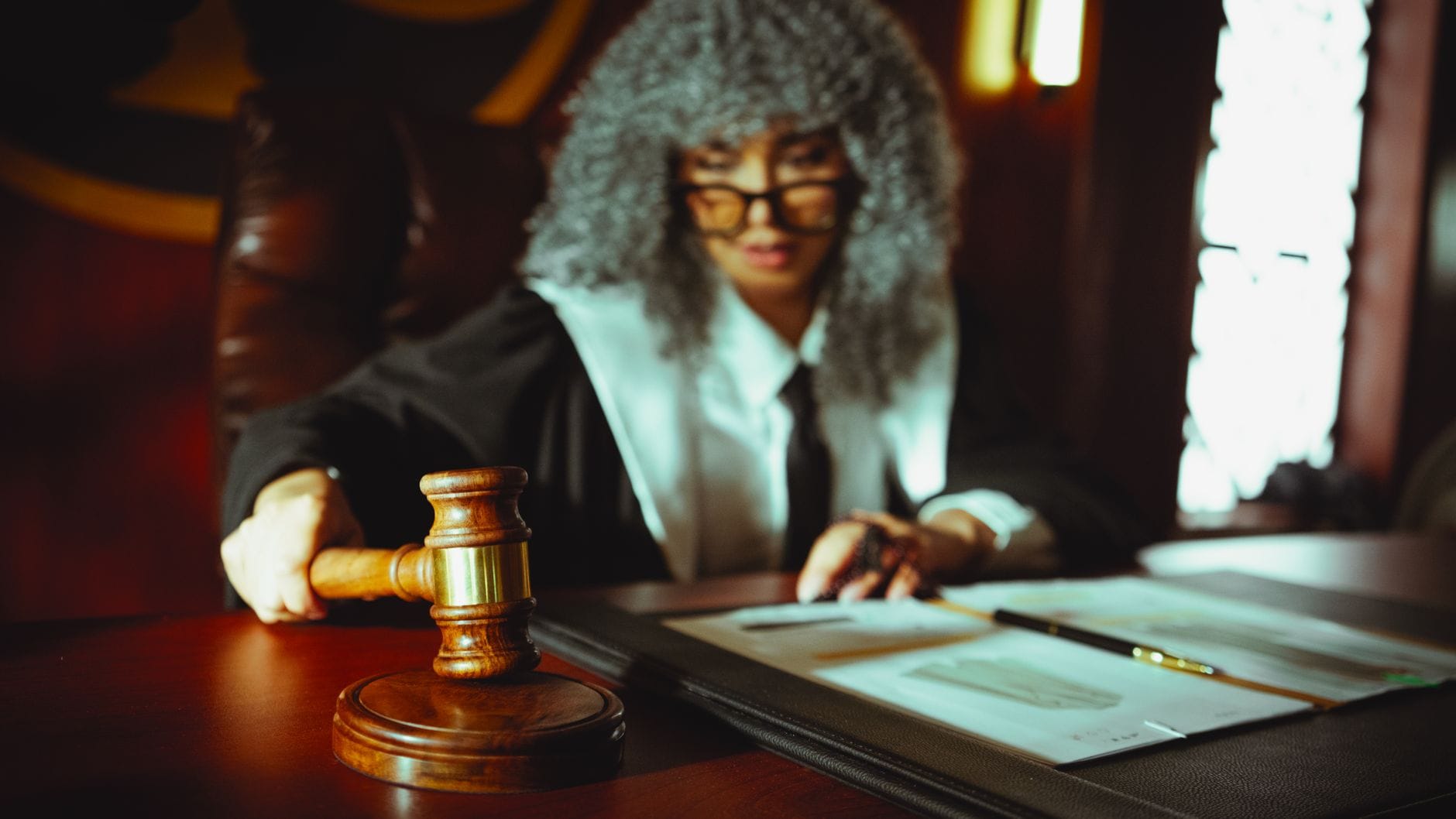 Legal documents and gavel representing state lawsuits against prediction market platforms