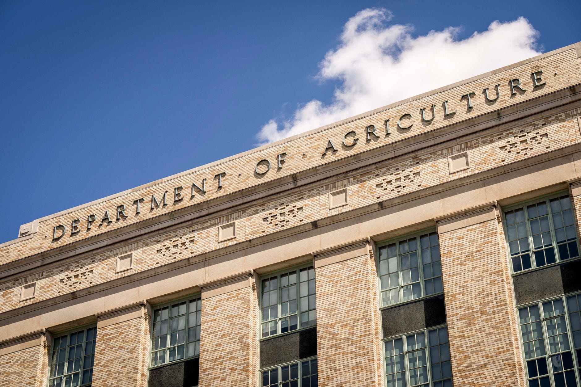 Regulatory documents and federal government building representing SEC crypto policy framework