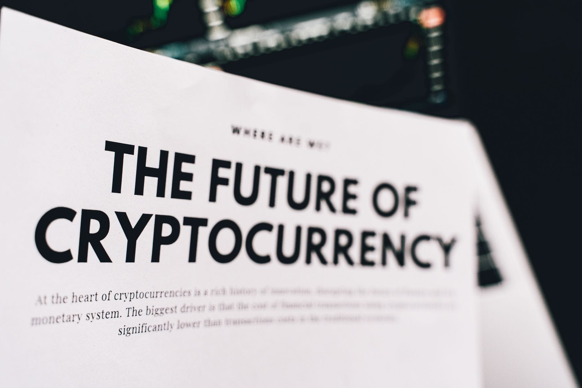 Regulatory documents and digital currency symbols on desk