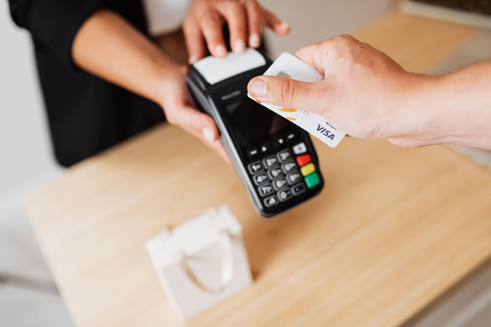 Visa payment terminal processing stablecoin-linked card transaction at merchant location