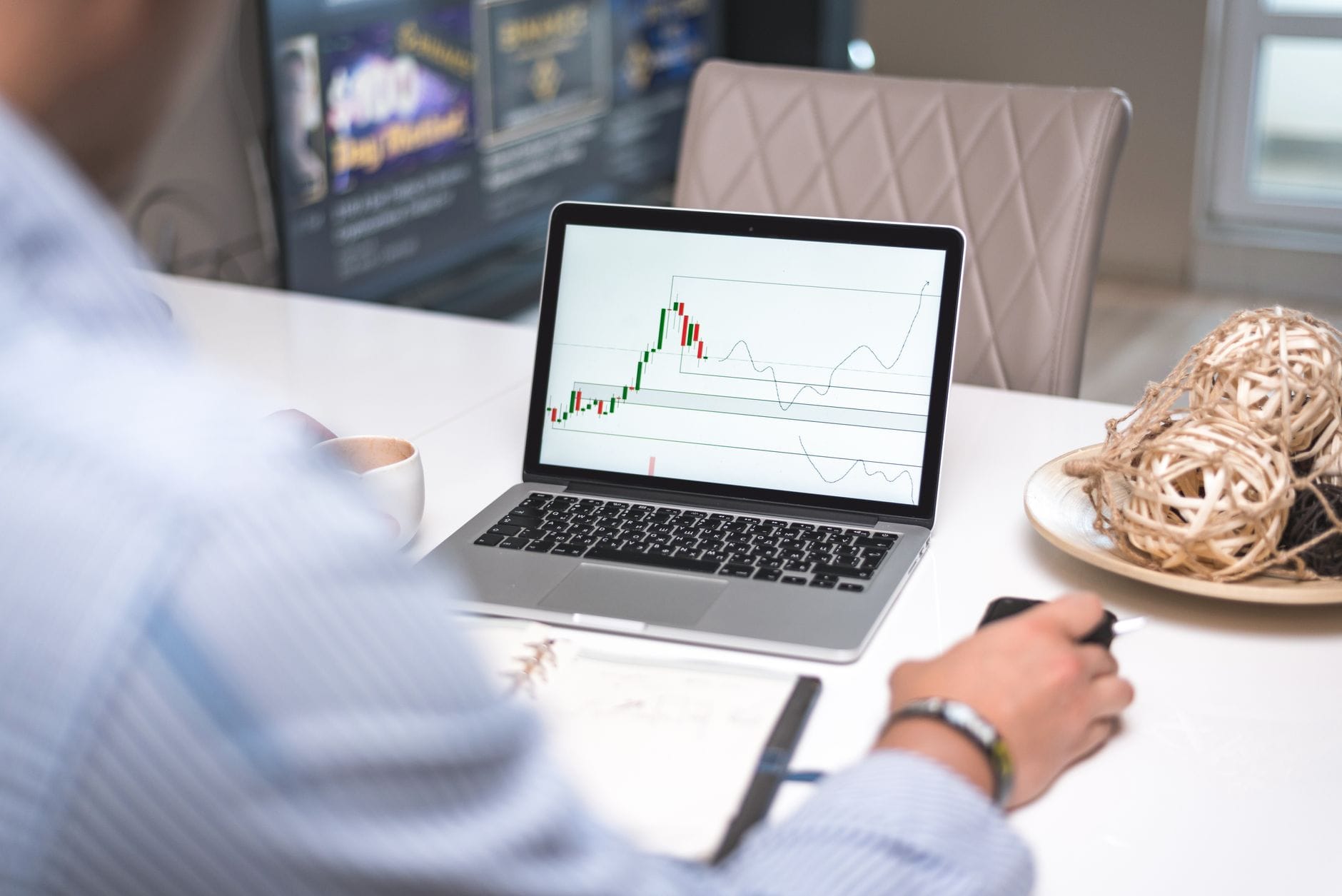 Analyst reviewing cryptocurrency market data and infrastructure developments on multiple screens