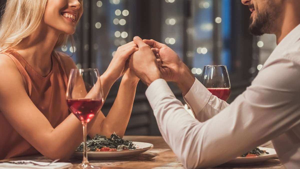 A female escort and her client enjoy a dinner date at a Los Angeles restaurant.
