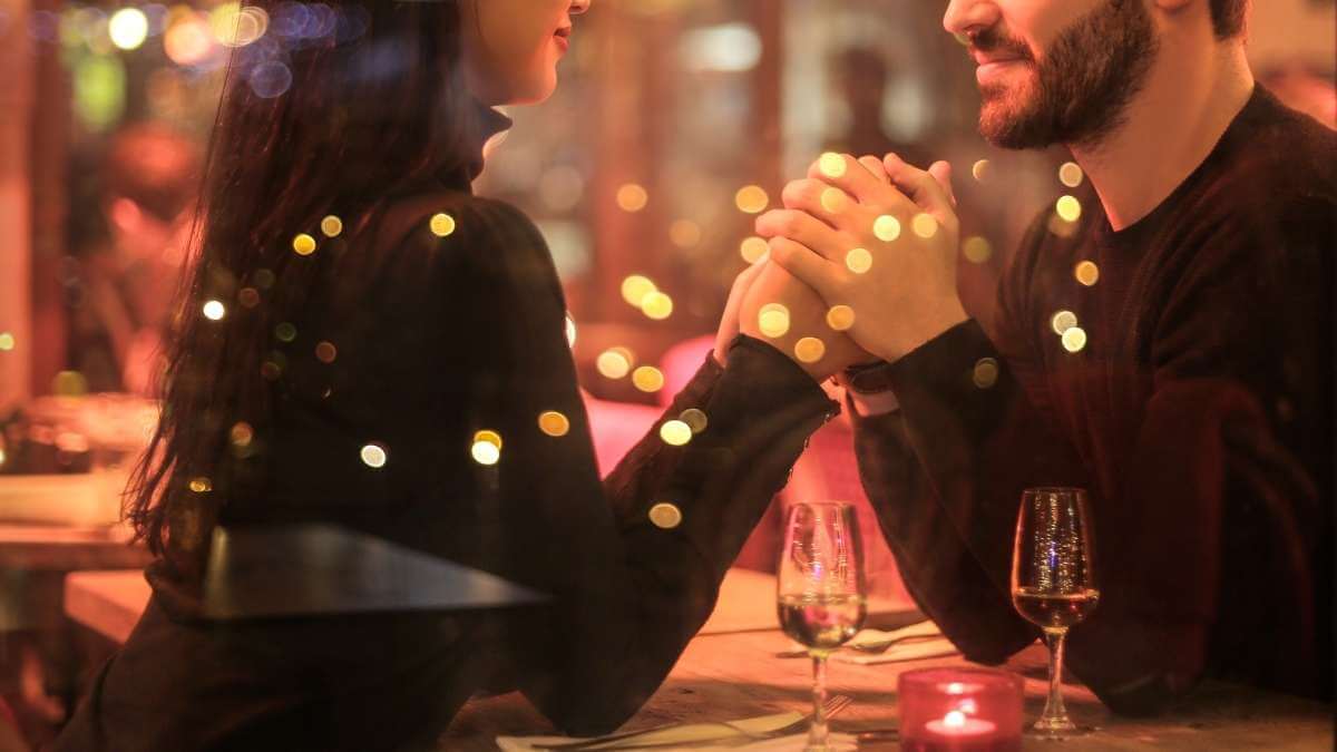 An escort client and his worker having dinner together in a romantic Las Vegas restaurant.
