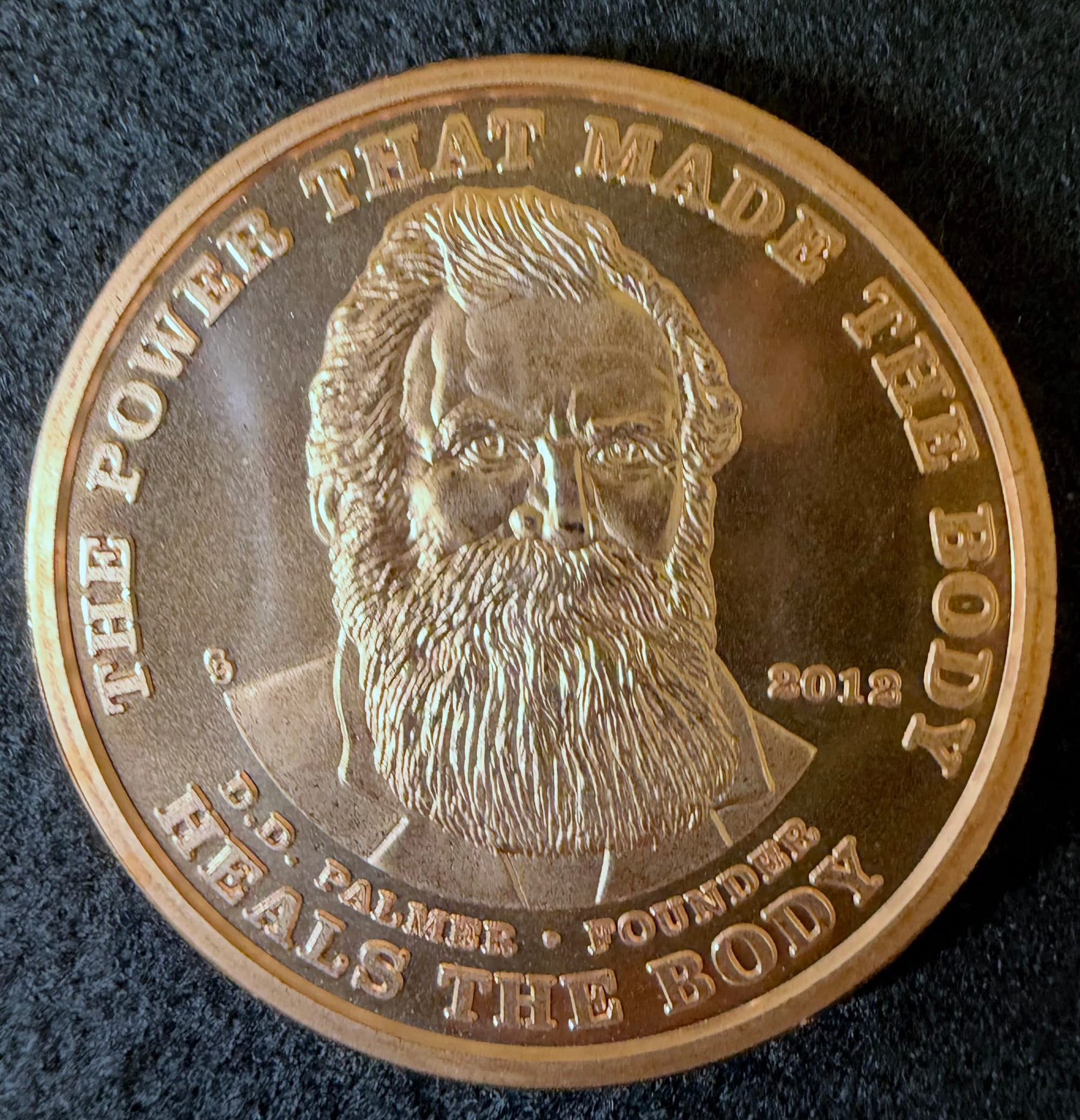 2012 Chiropractic Dollar D.D. Palmer copper obverse