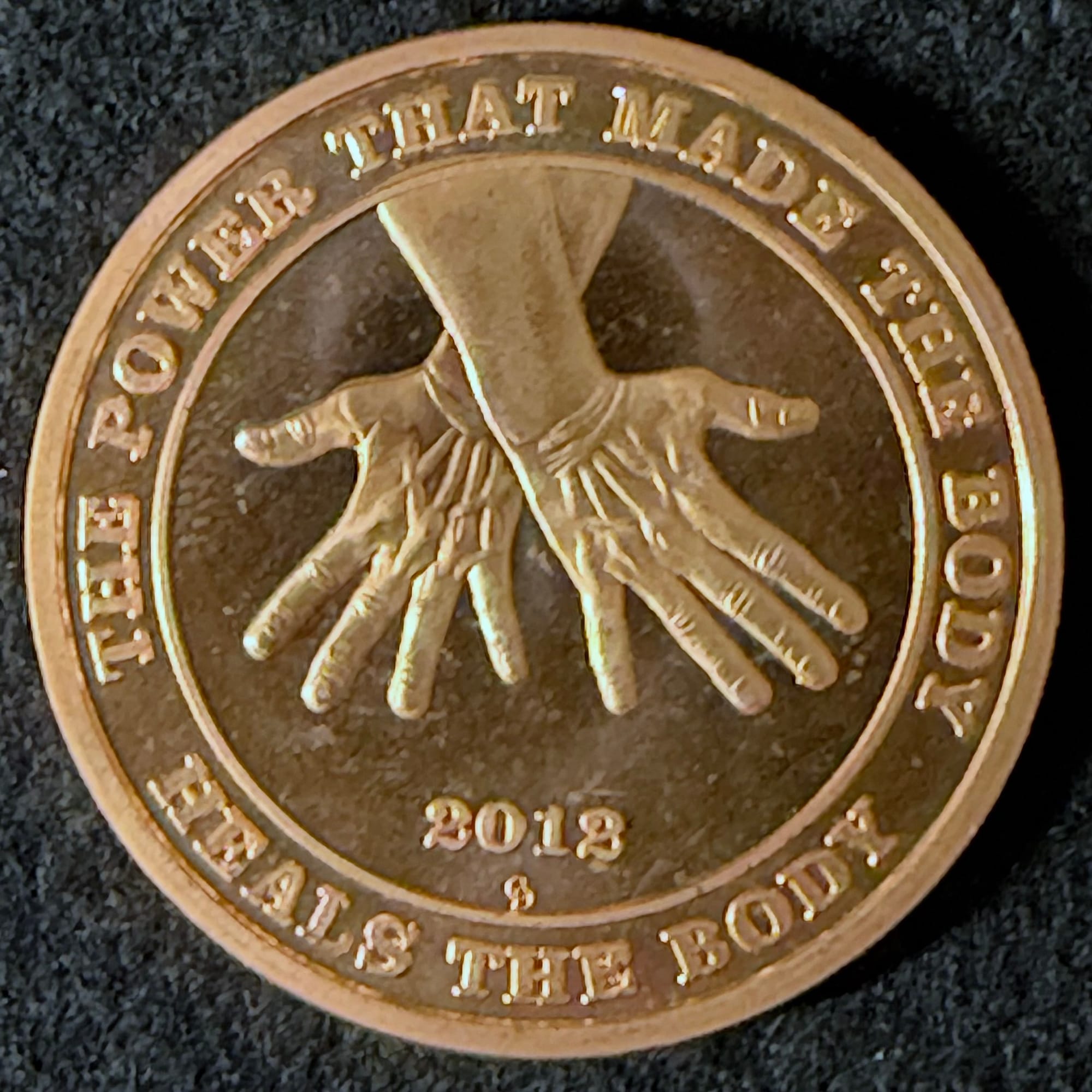 2012 Chiropractic Dollar Healing Hands copper obverse