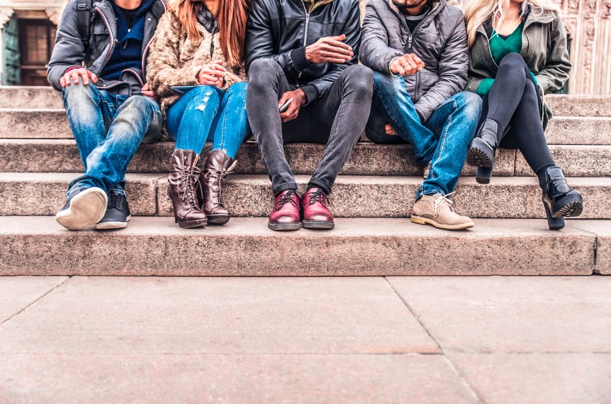 brand awareness - group of people on steps and you can only see from the waist up