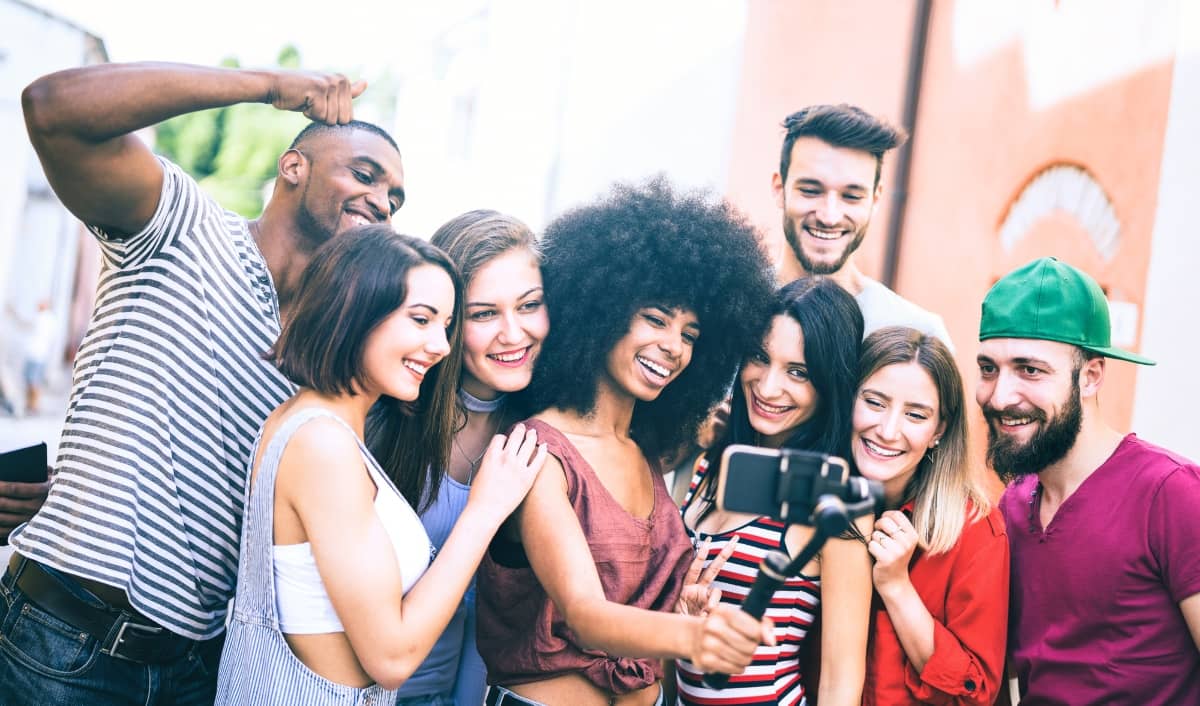 social media engagement - group of friends taking selfies