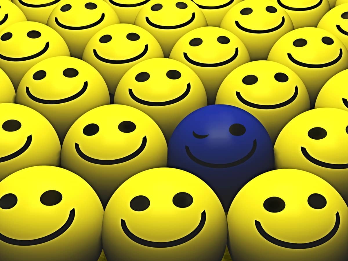 ecommerce email marketing - yellow smiling emojis with one winking blue smiley emoji