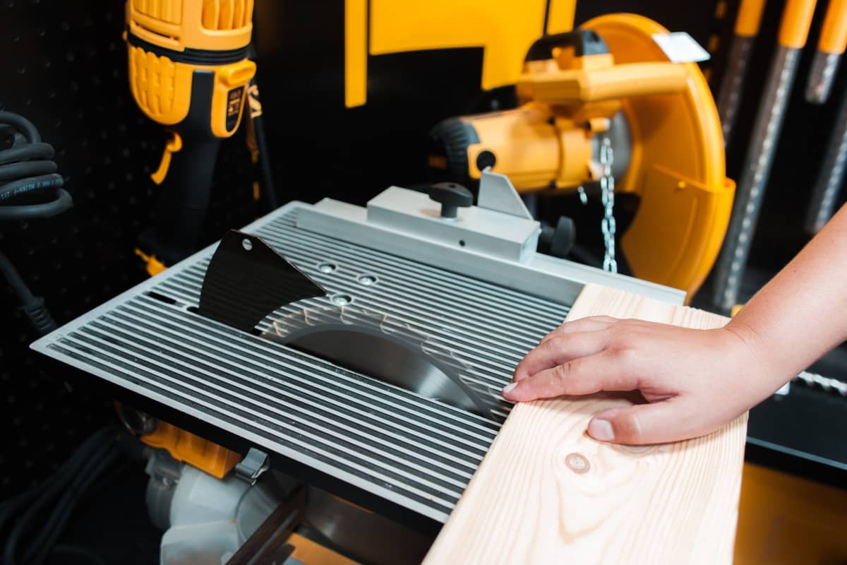 employee engagement - man's hand close to the blade of a table saw