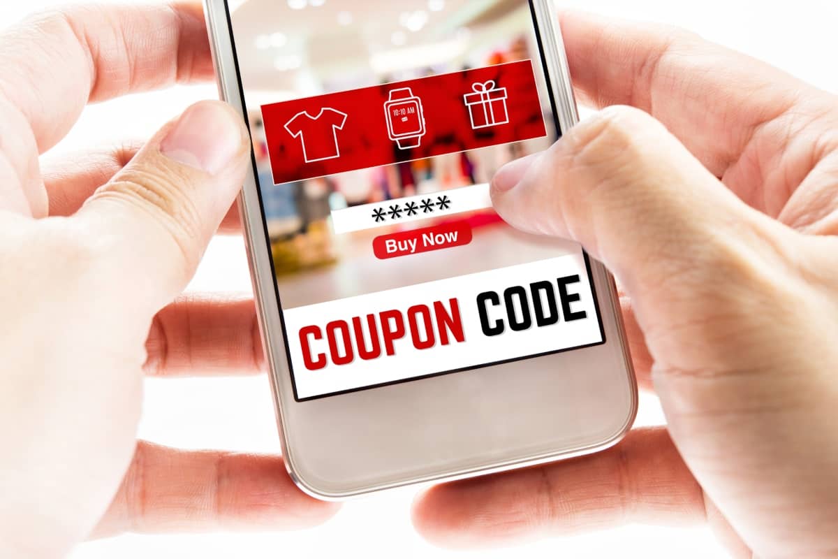 affiliate marketing strategies - smartphone with a coupon