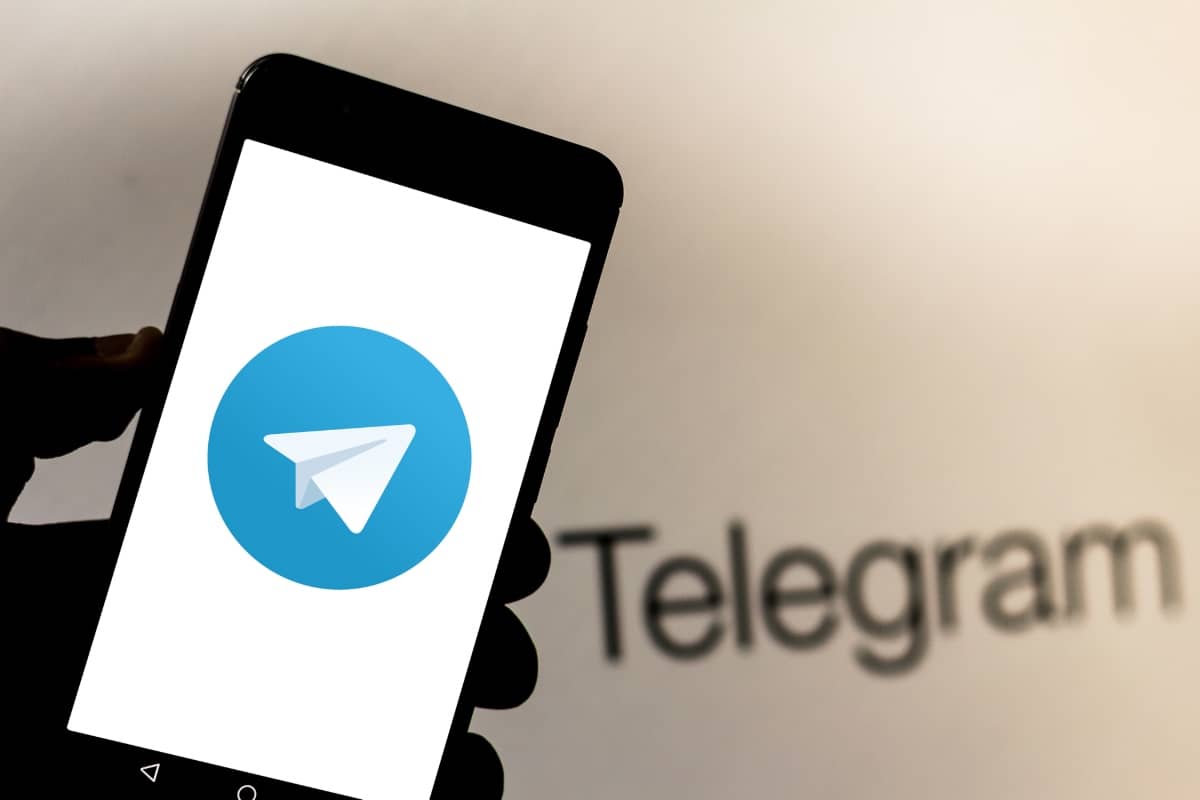 social-media-platforms - smartphone with Telegram logo