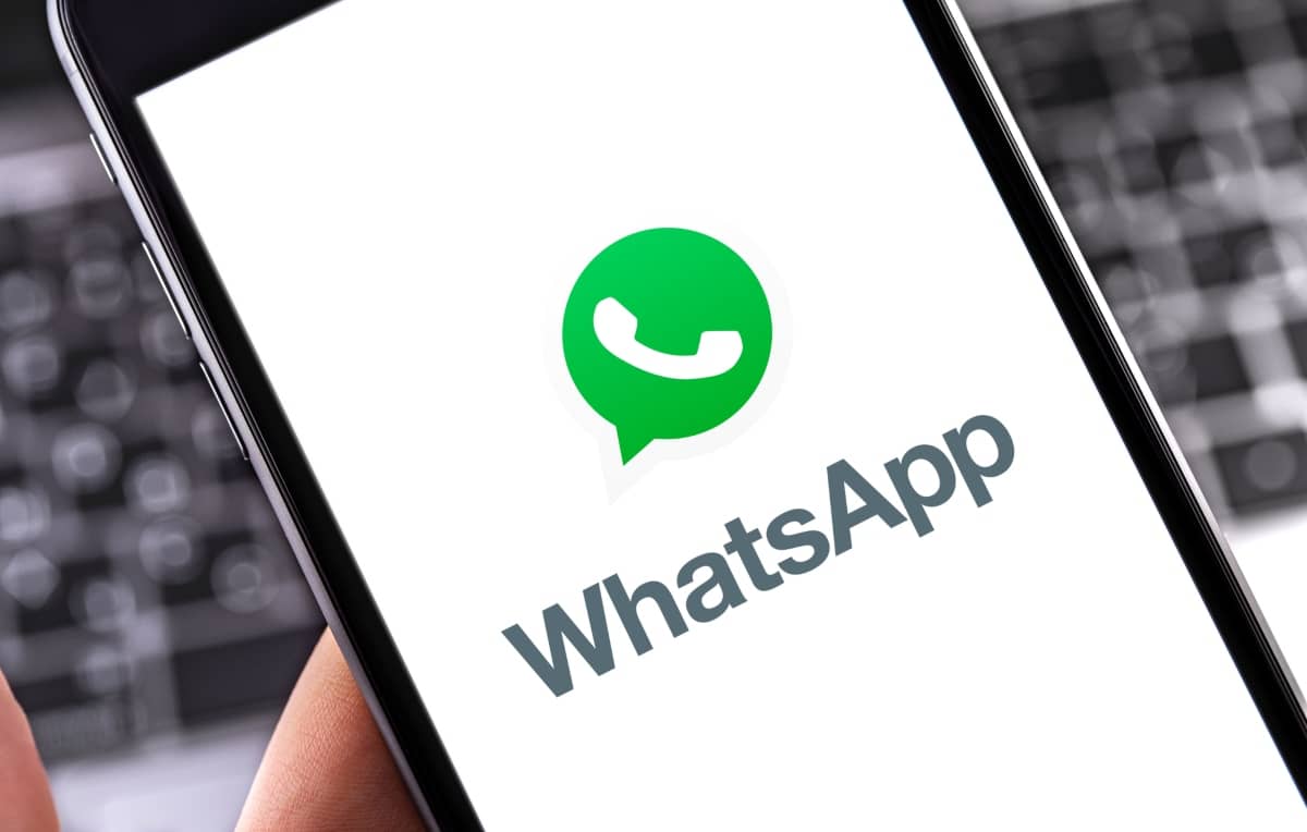 social-media-platforms - smartphone with WhatsApp logo