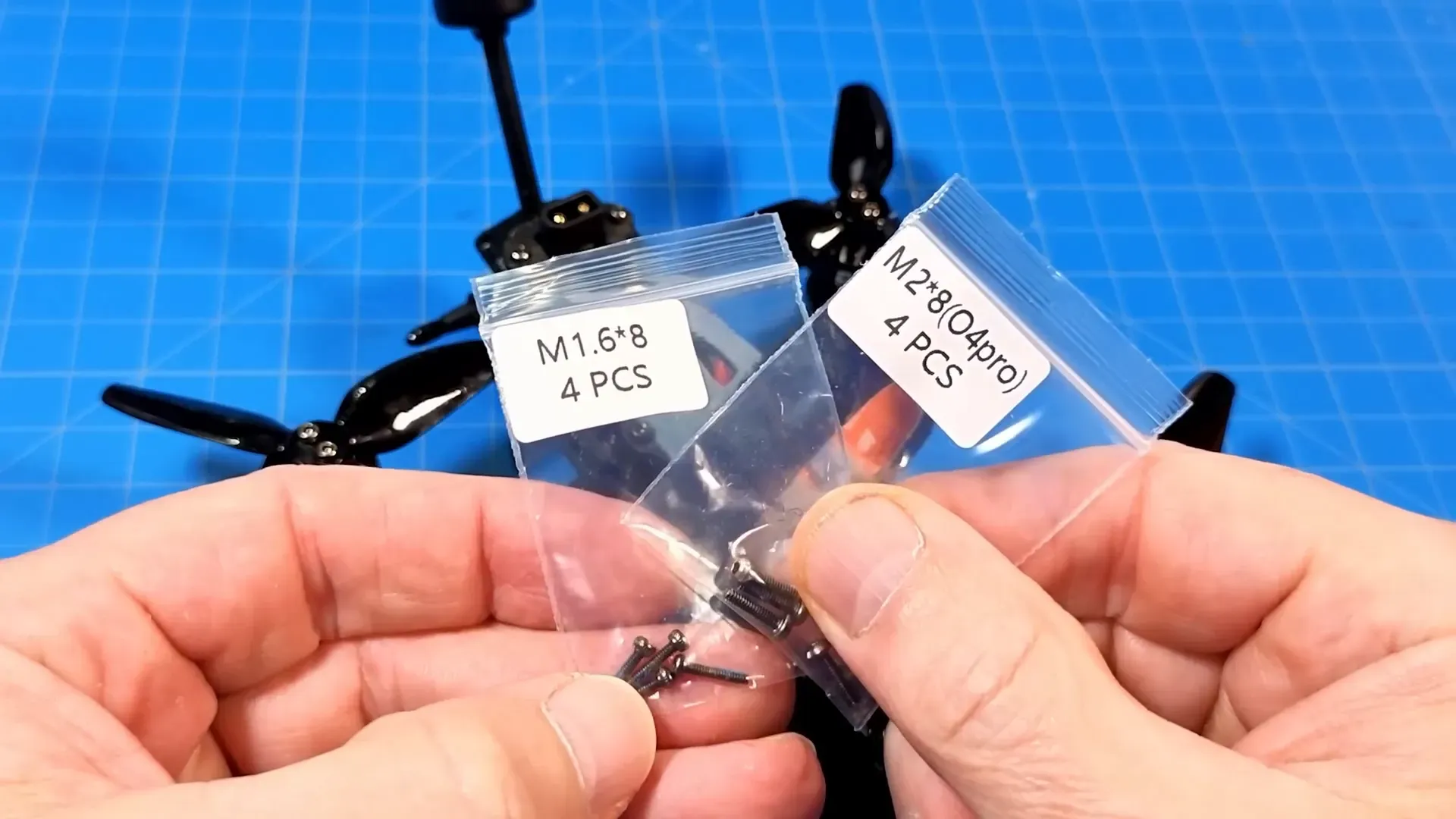 Accessories laid out: straps, screws, and props