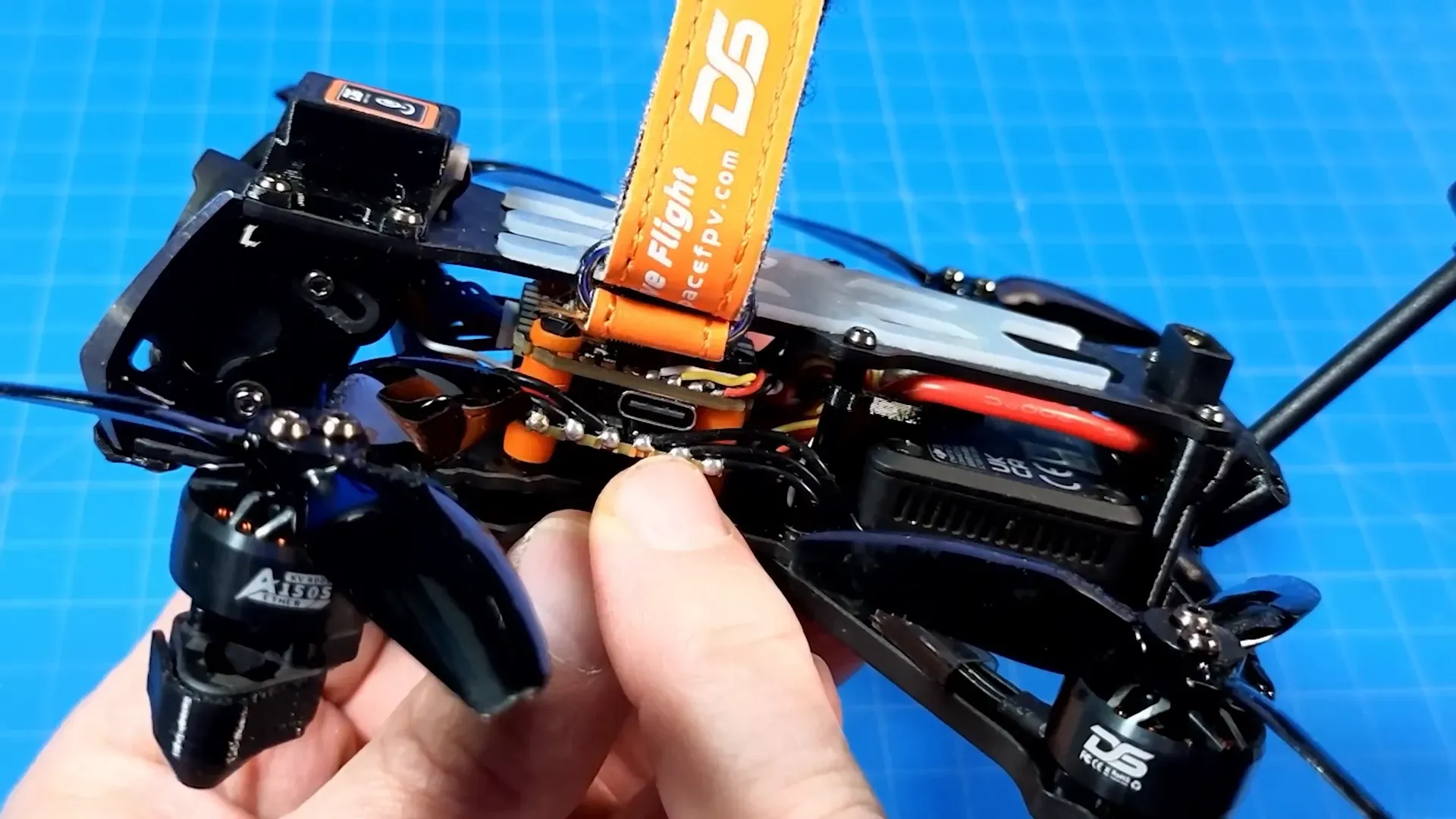 Flight controller and ESC visible under canopy