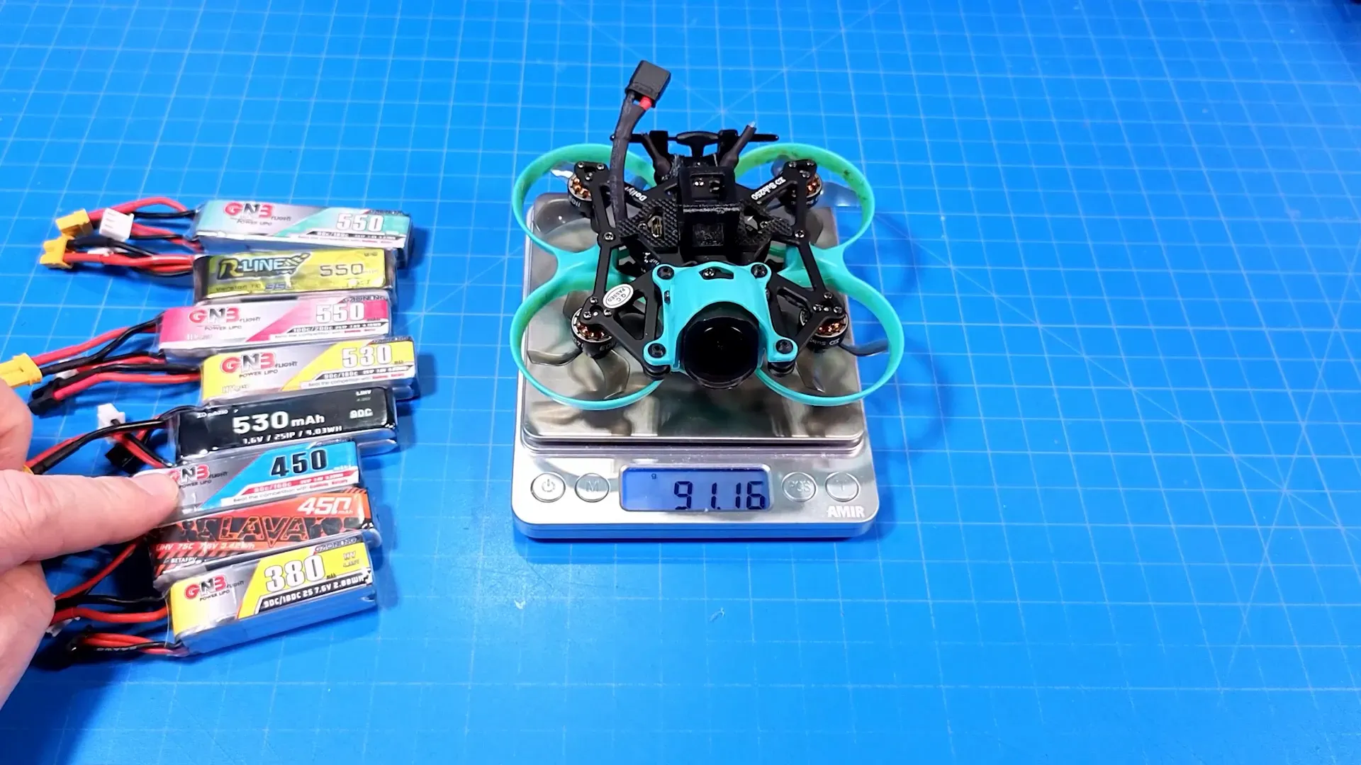 Battery on scale showing weight with Tattoo 5.5 installed