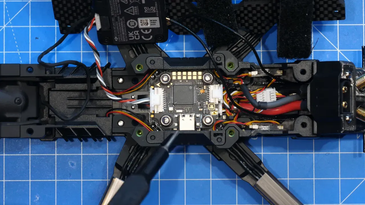 Flight controller close-up inside with text mentioning Borg Mini F7