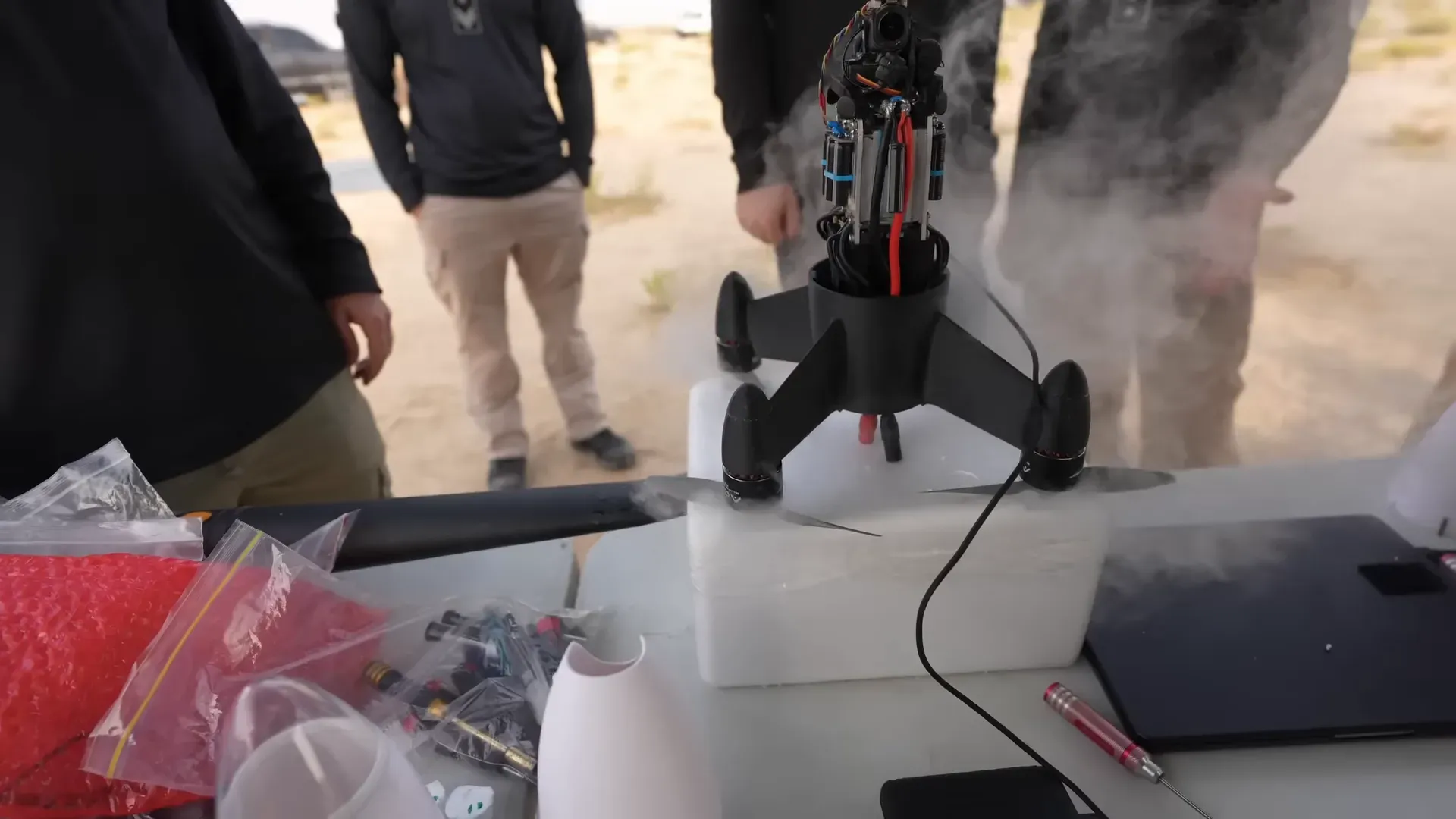 Team applying dry ice to motors pre‑flight