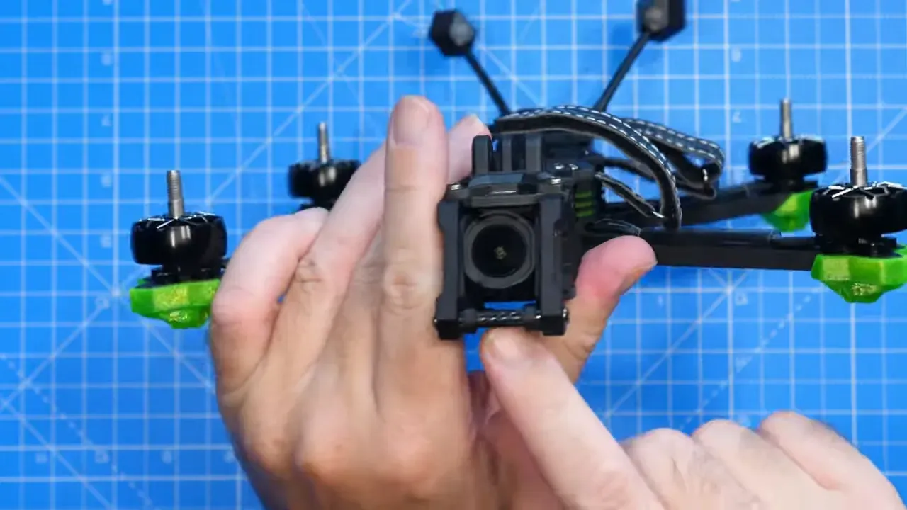 Aluminium camera cage and silicon isolation pads around camera