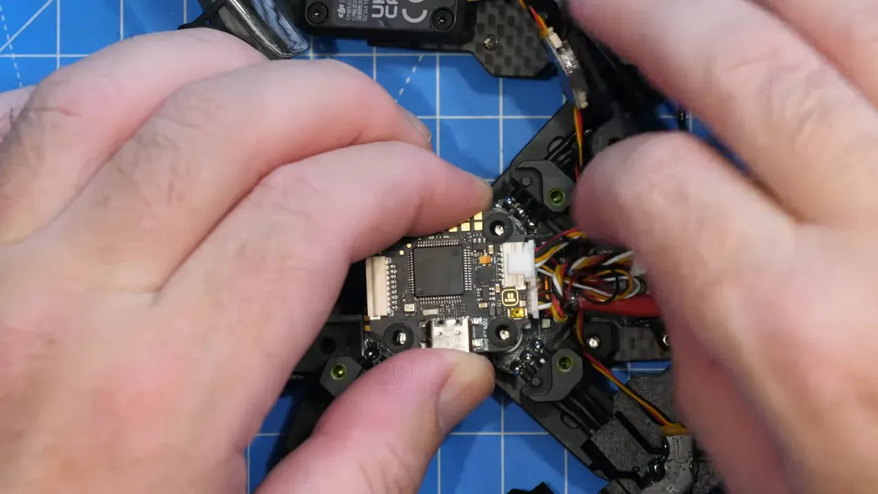 Flex ribbon cable connecting FC to ESC visible