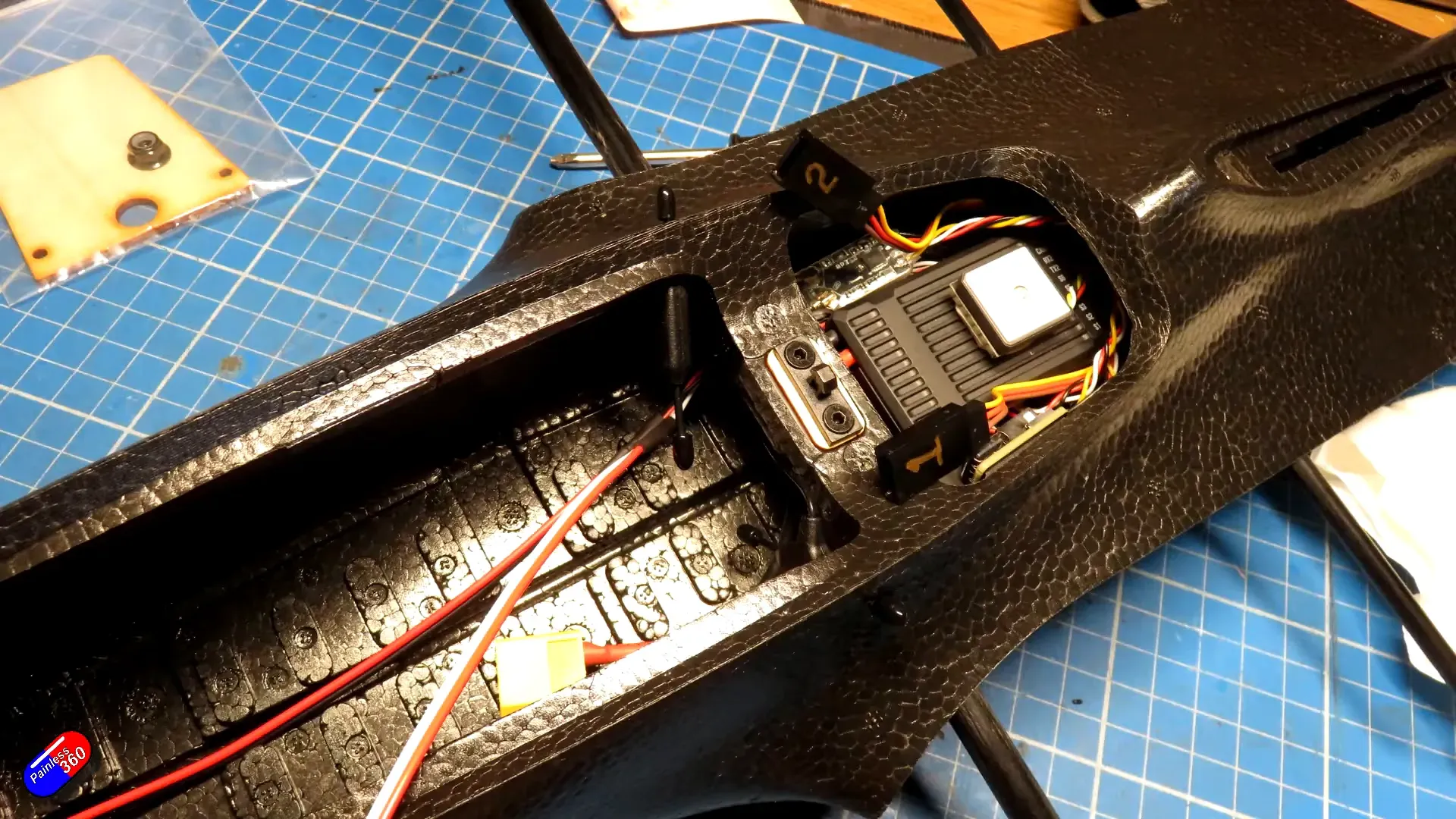 flight controller and GPS tucked into the nose