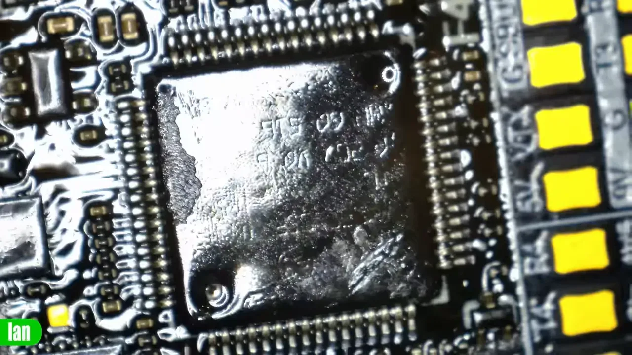 Under‑microscope shot showing STM32F405 marking