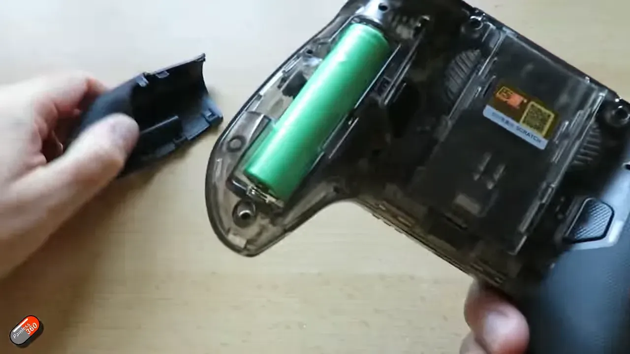 Grip removed showing the 18650 battery compartment and easy pull recess