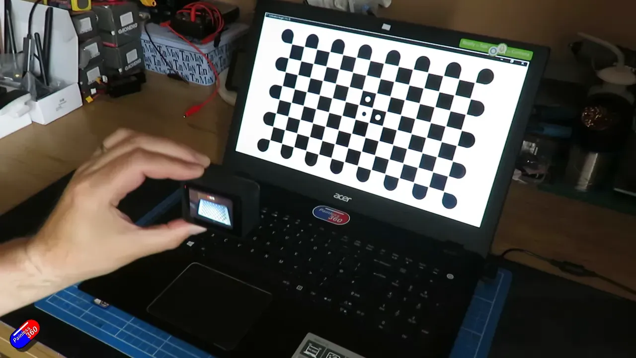 Action camera recording a checkerboard target filling the frame
