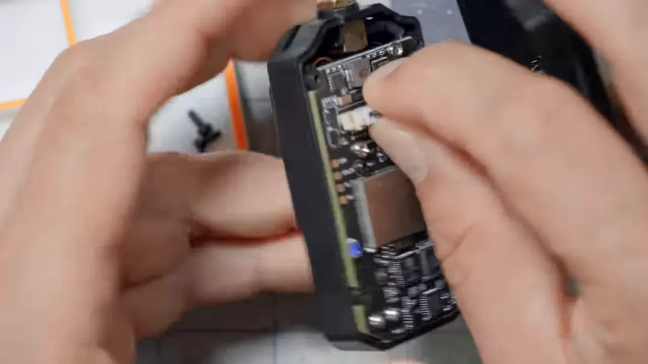 RadioMaster module opened showing UART pads
