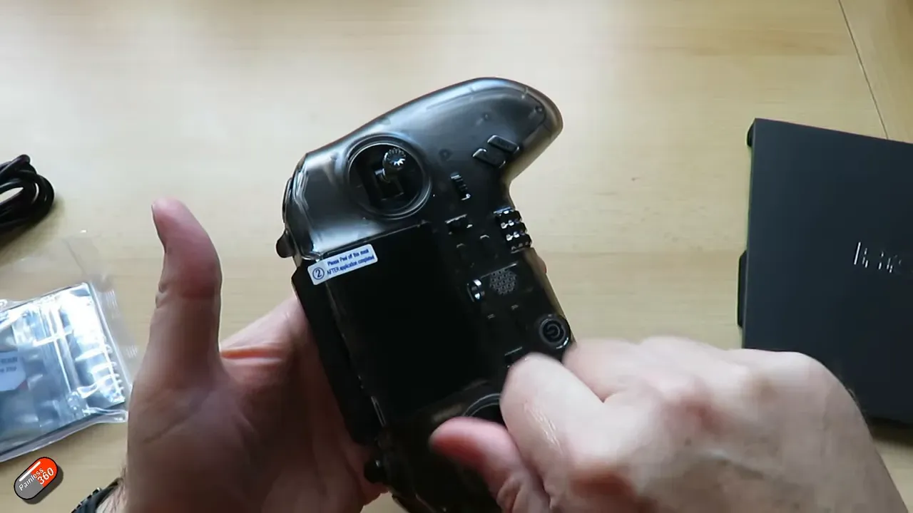 Power-on shot showing the internal RGB LEDs glowing through the translucent case