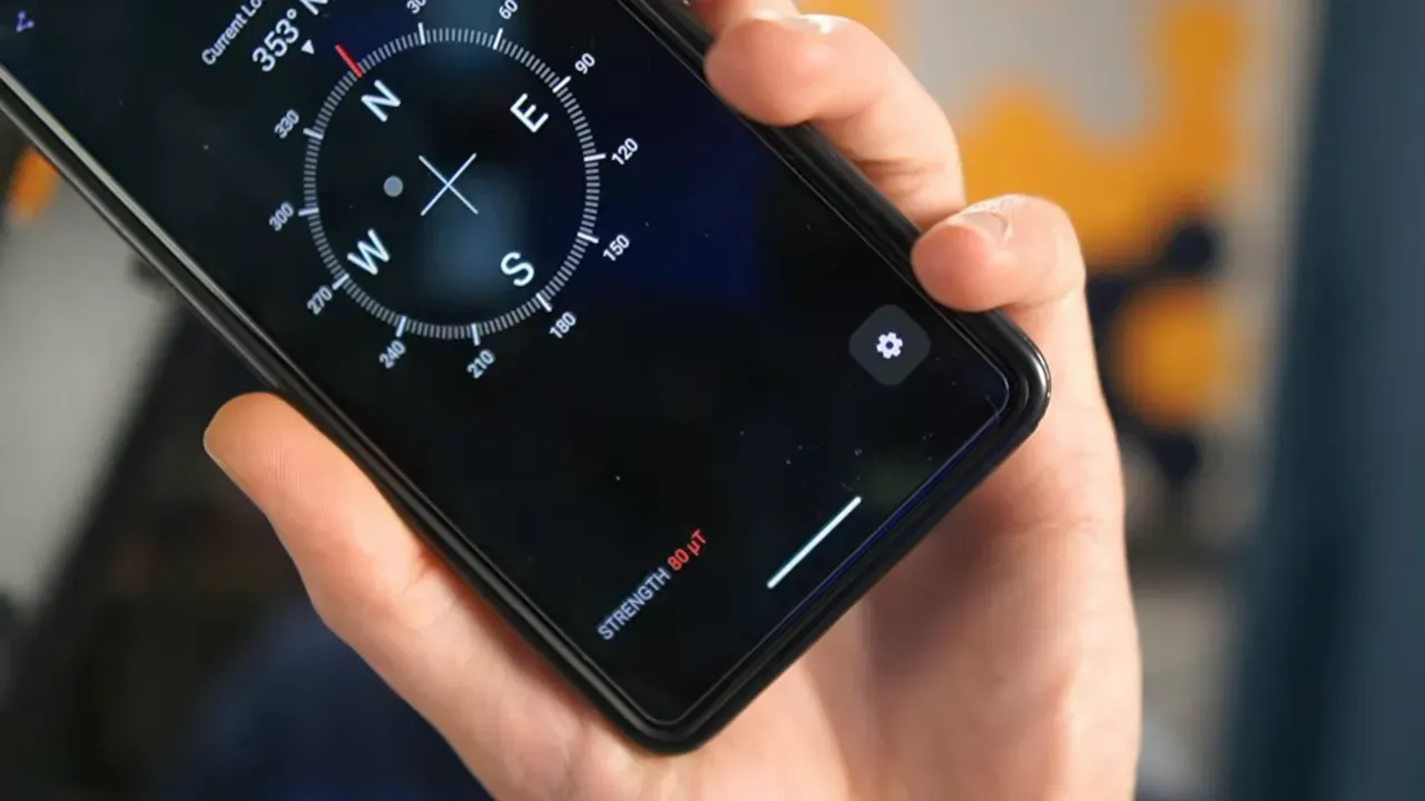 Close-up of a smartphone compass app showing magnetic strength readout