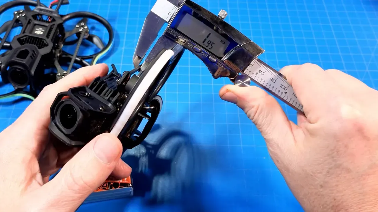 Measuring Pavo20 Pro II carbon plate thickness with digital caliper showing 1.95 mm