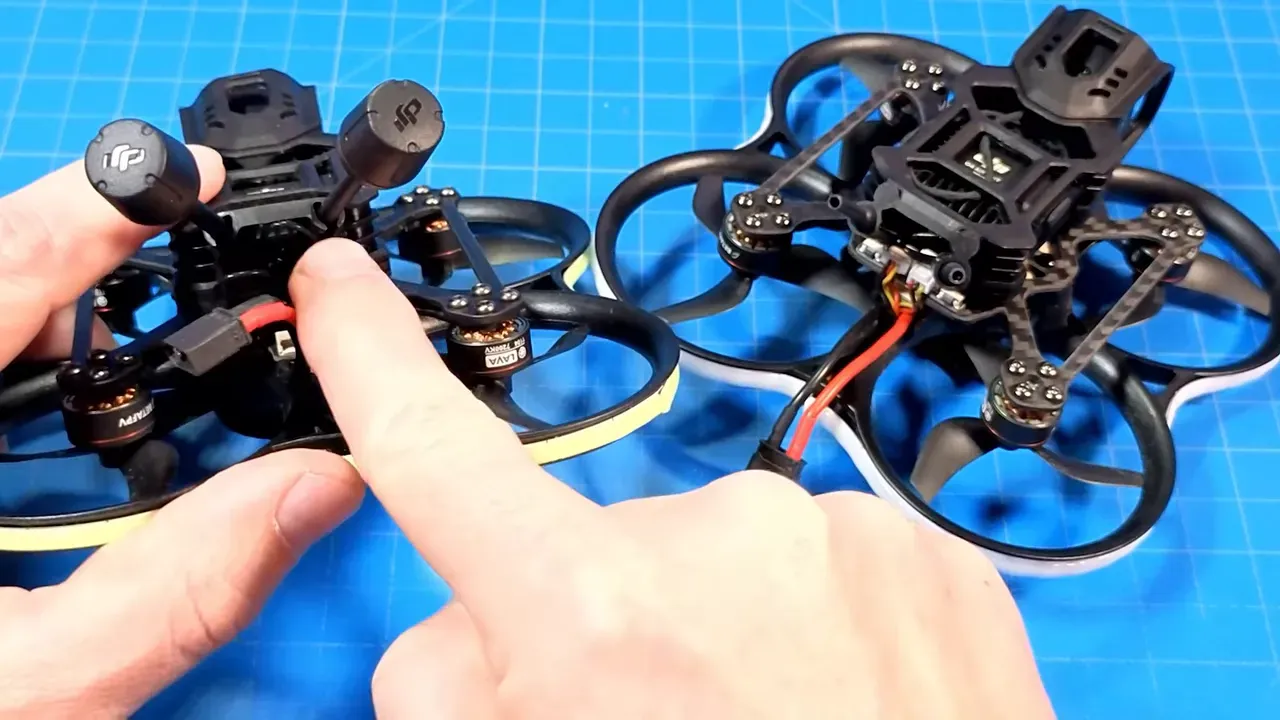 Close-up of two Pavo20 Pro II micro quads showing exposed external antennas on one unit and a tidy micro antenna setup on the other.