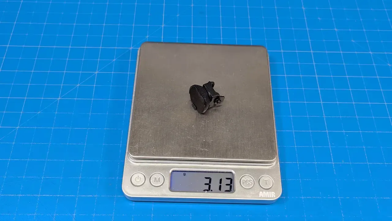 HappyModel FOV extender placed on a digital scale reading 3.13 grams