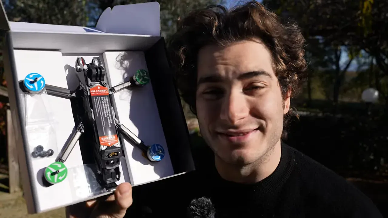 HGLRC NBlade MAX 5-inch drone in its retail box held up to camera