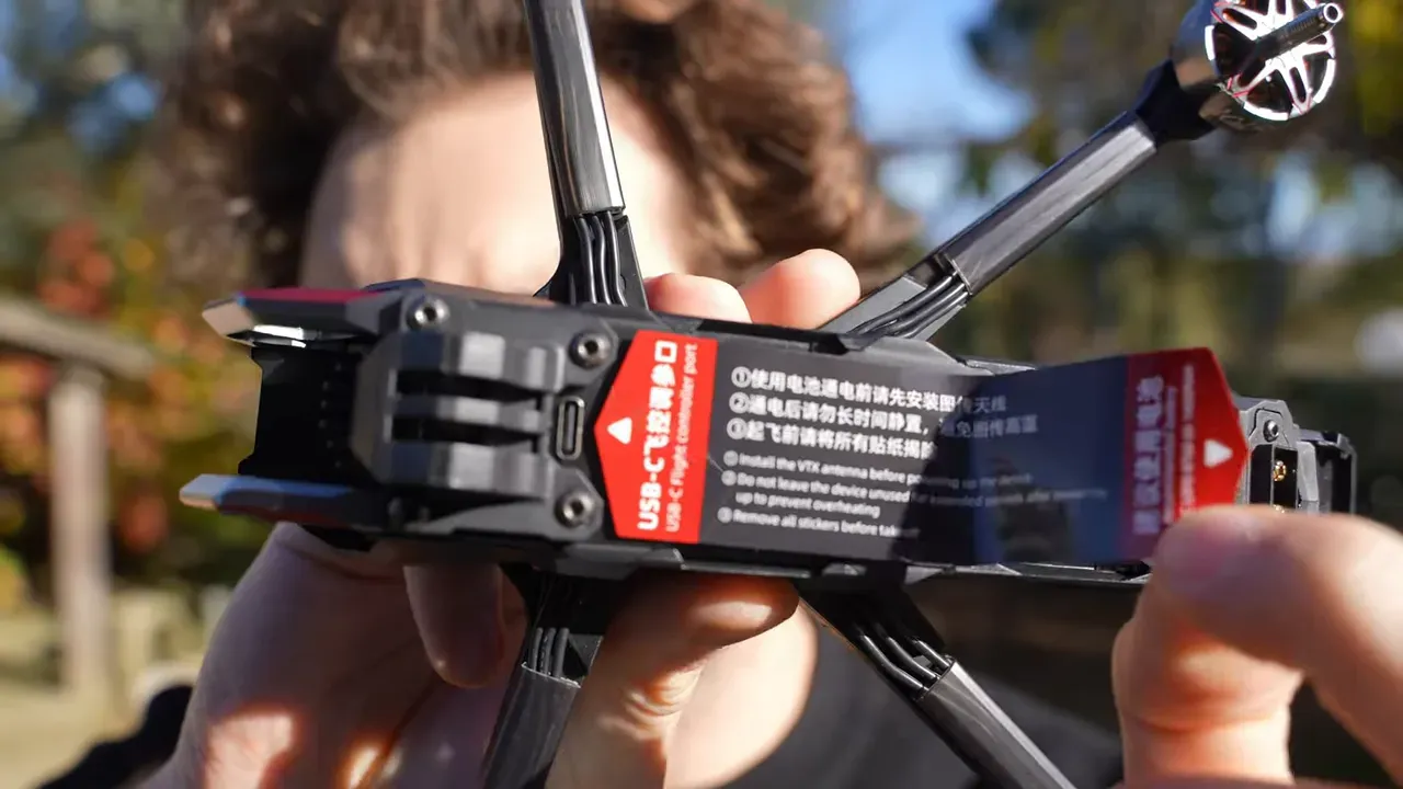 NBlade MAX underside with USB-C flight controller port and warning sticker