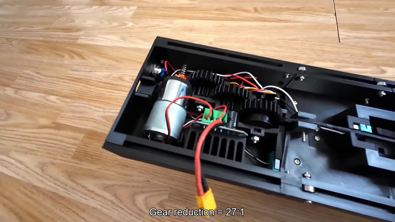 Winch assembly showing a 12V brushed motor, 3D‑printed gearbox and gear train