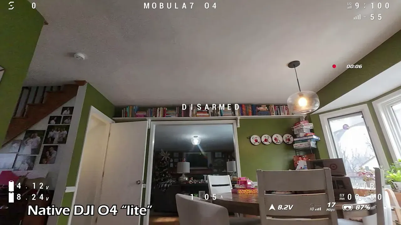 Wider DJI O4 Lite DVR frame of a dining room interior with clear telemetry and on-screen indicators