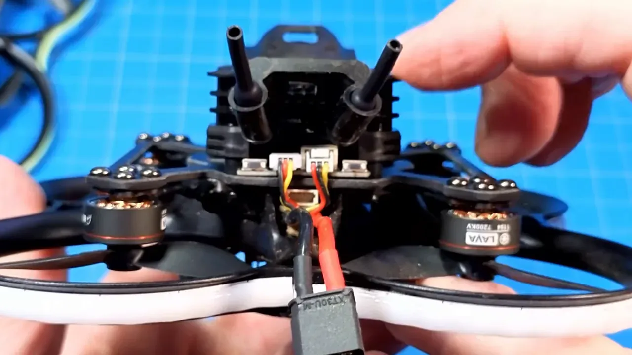 Close-up of the daughter board between the camera post and mount on a Pavo20 Pro II, showing connectors and routed wires