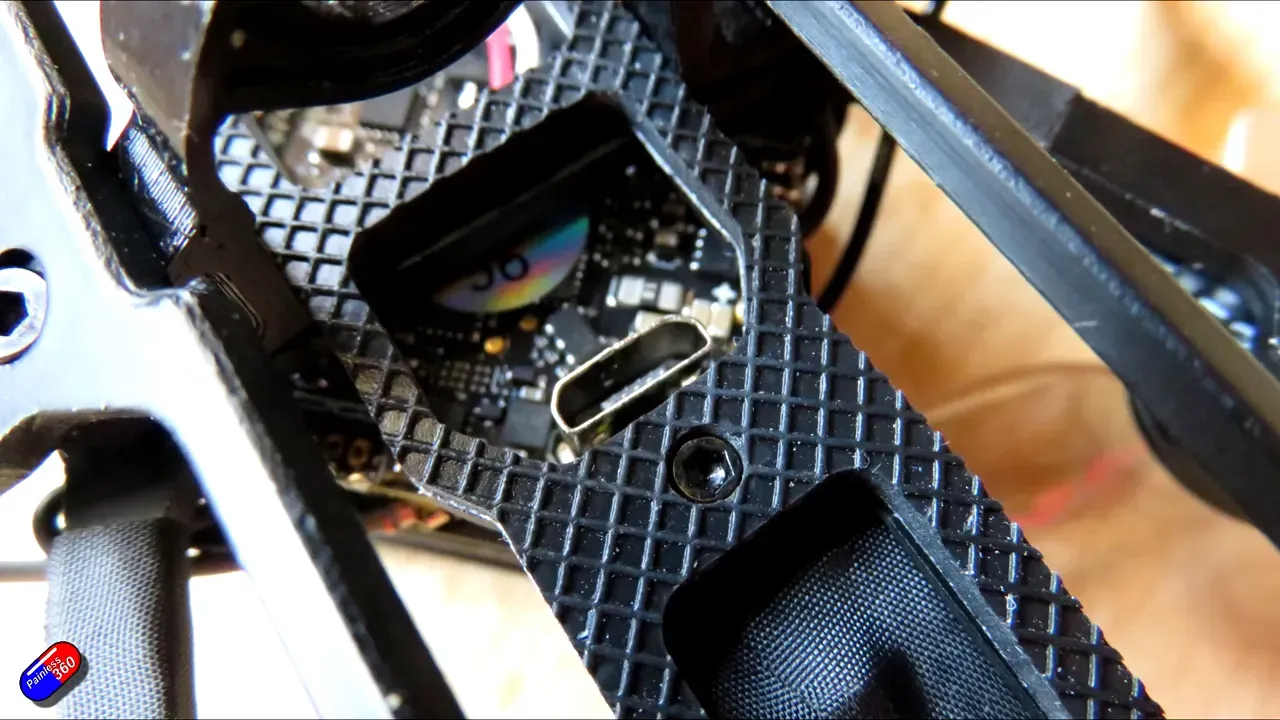 USB‑C port under the Carbonfly 80 battery bay visible through the frame cutout