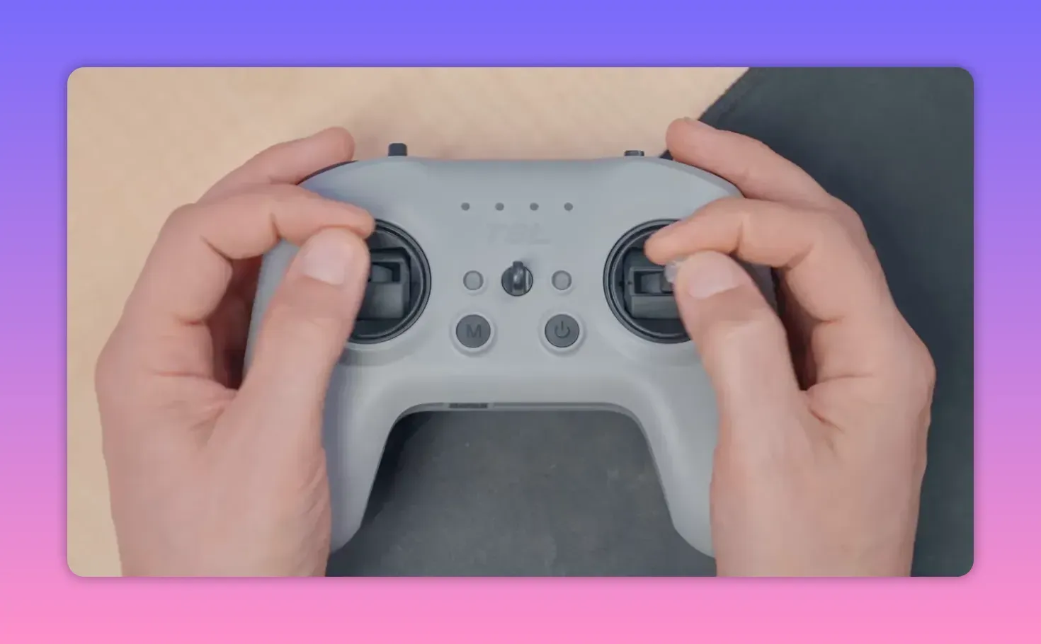 Close-up overhead view of the RadioMaster T8L controller showing both Hall-effect gimbals and the stick ends with hands holding the radio.