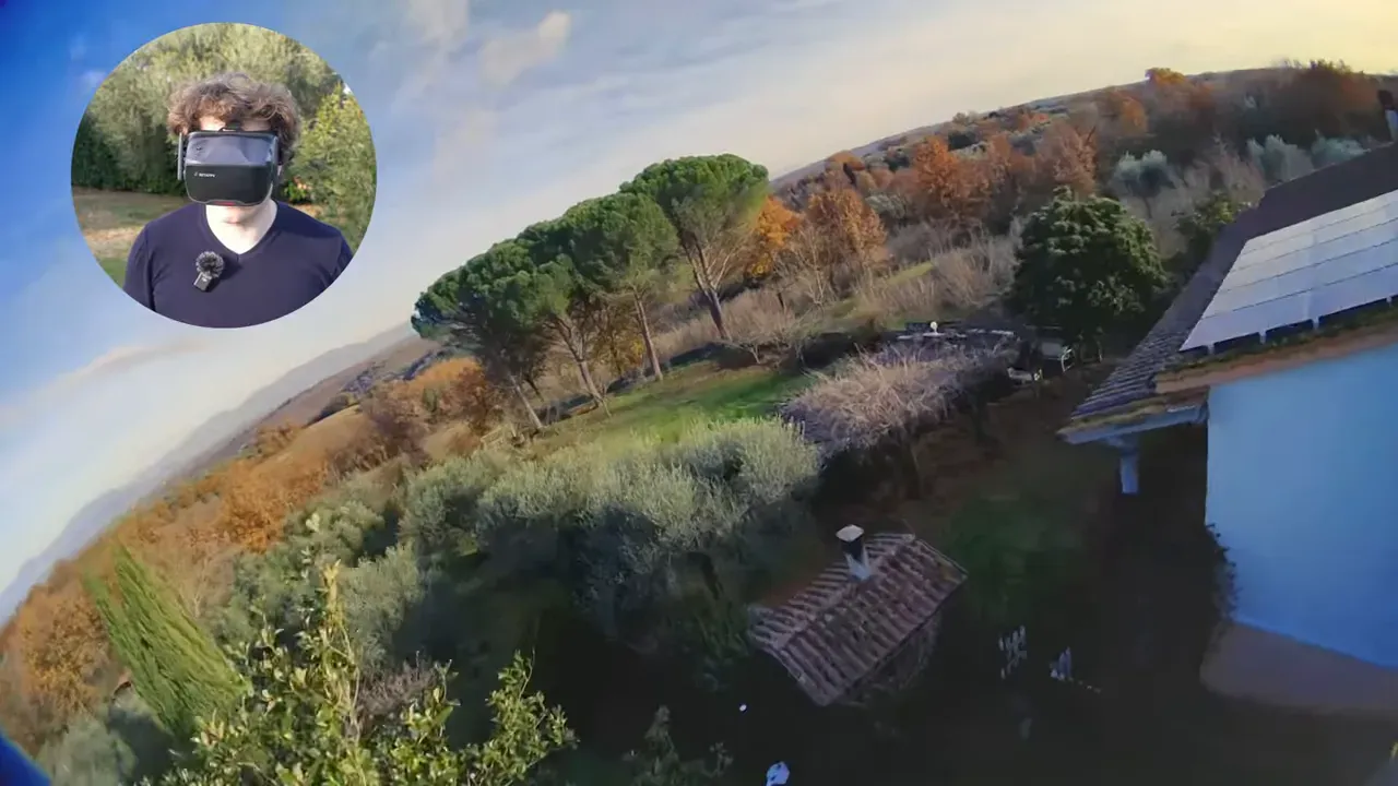 Tilted FPV view over trees and roofs with circular presenter inset wearing VR04 goggles demonstrating the live feed