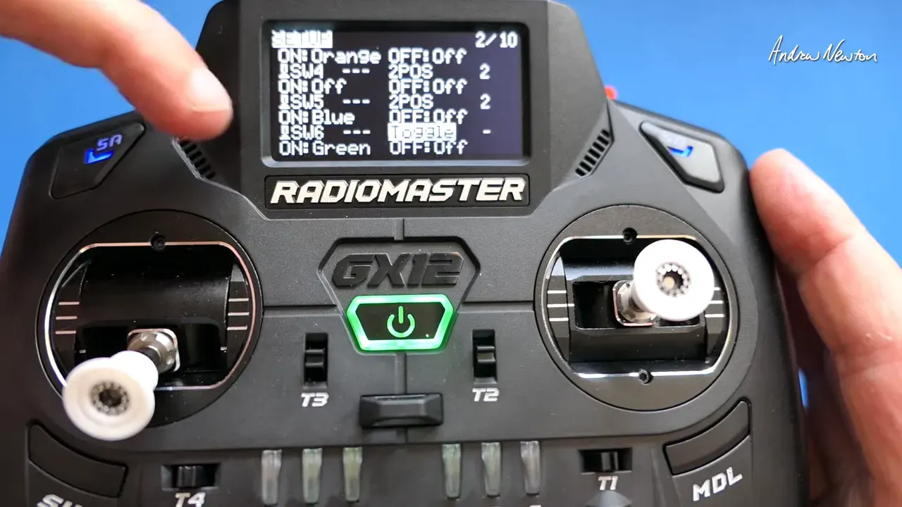 Radiomaster GX12 screen showing the Customizable Switches menu with the word 'Toggle' visible and a finger near the top-left selecting the option.