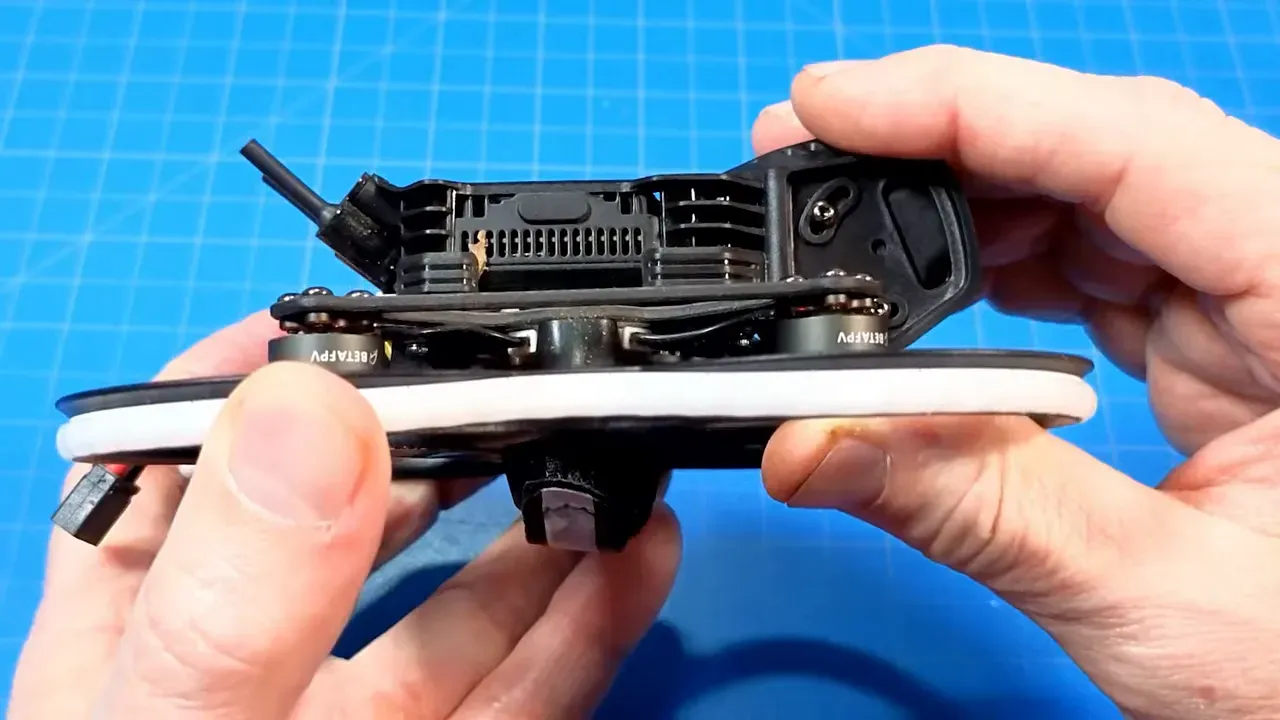 Front/side close-up of Pavo20 Pro II showing rubber-damped camera mount seated over daughter board and visible screw heads