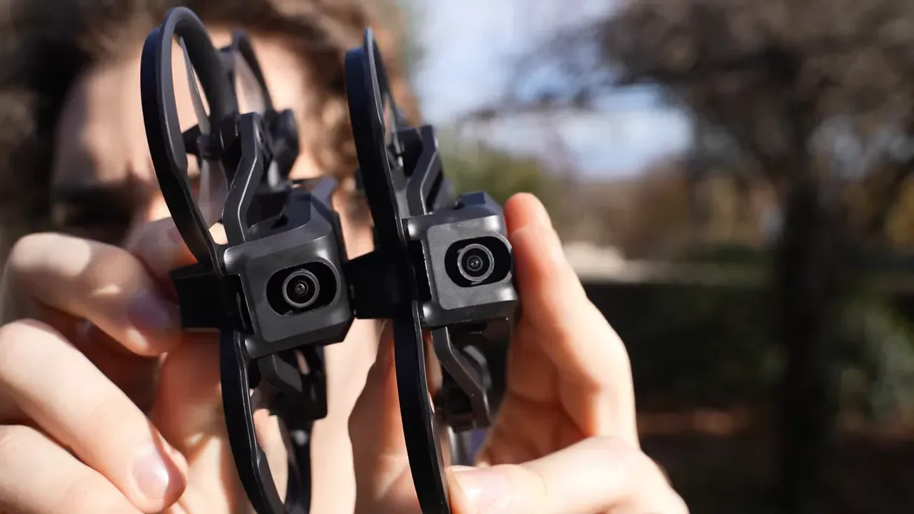 Close-up of two Aquila20 HD forward cameras and sensor housings held close to the camera